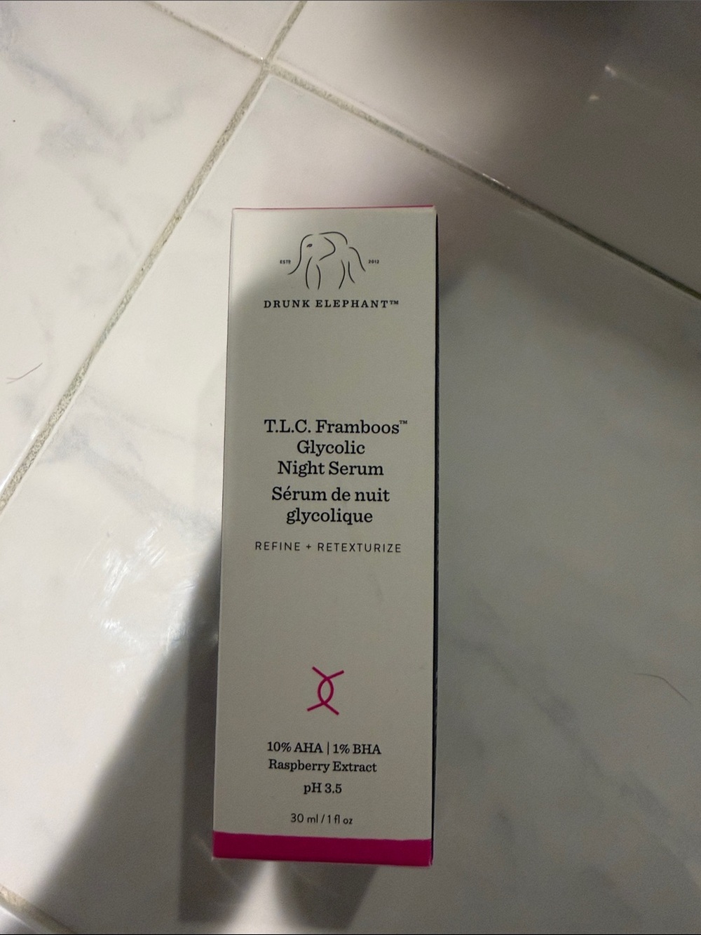 Drunk Elephant Night Serum Box with White and Pink Accents